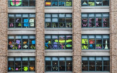 Two Buildings on Canal Street Are Waging a Post-it War in Their Windows